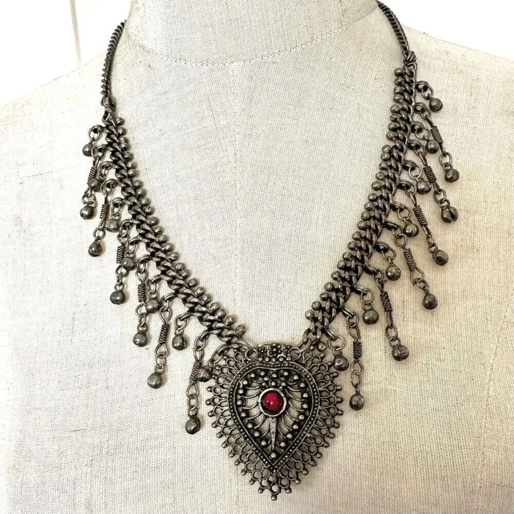 Ethnic silver tone heart pendant necklace with coral center